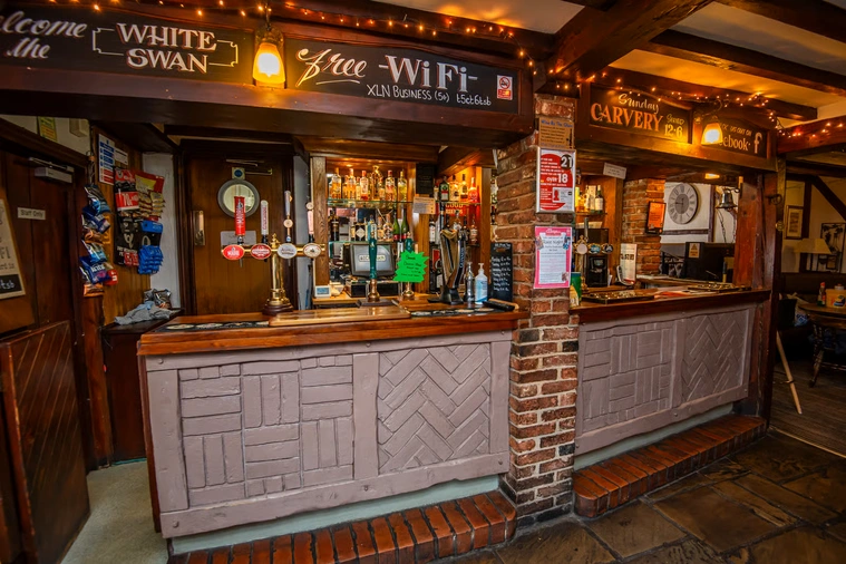 Bar area with guests socialising